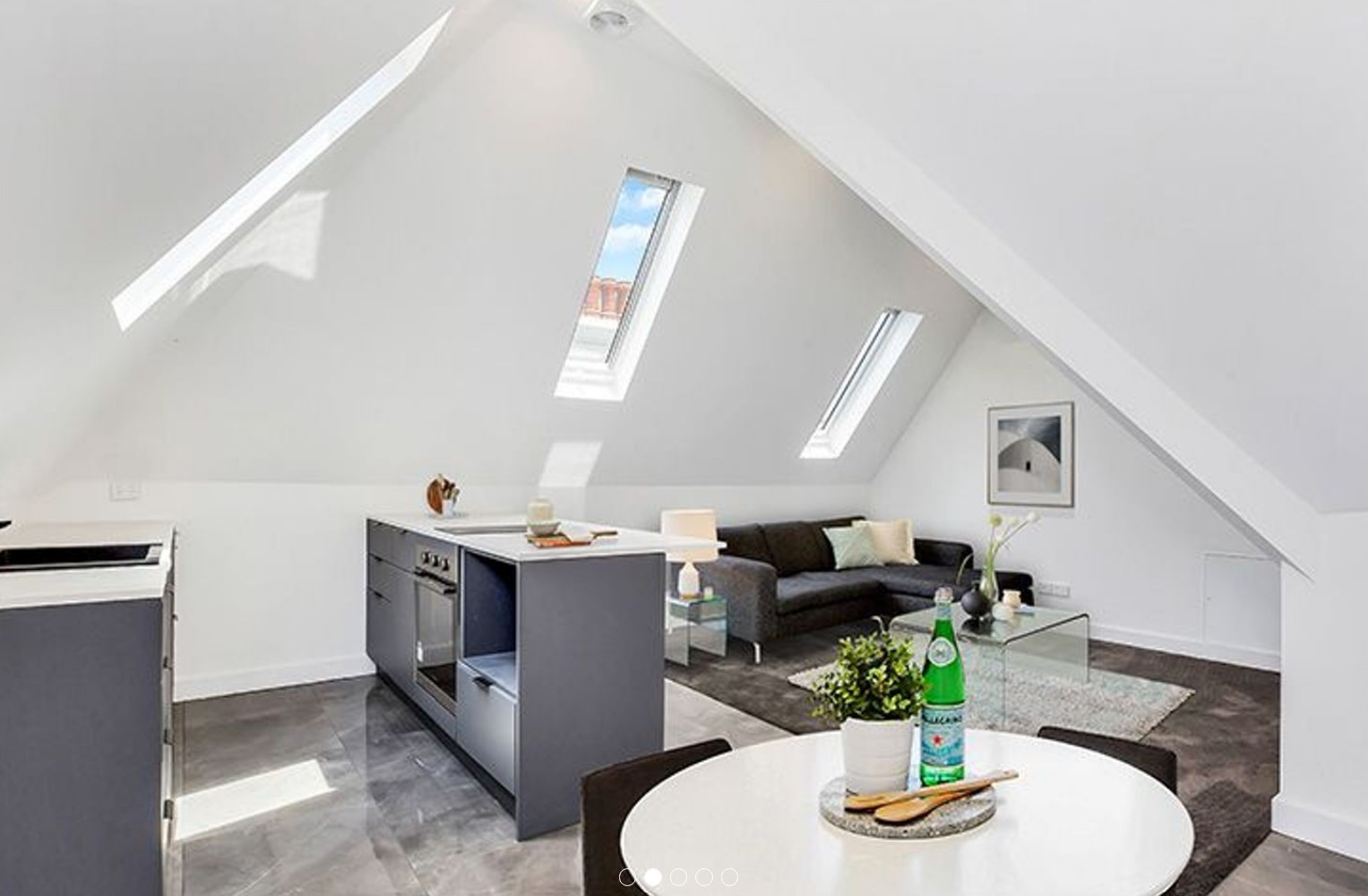 Arncliffe attic after - modern open-plan living with skylights