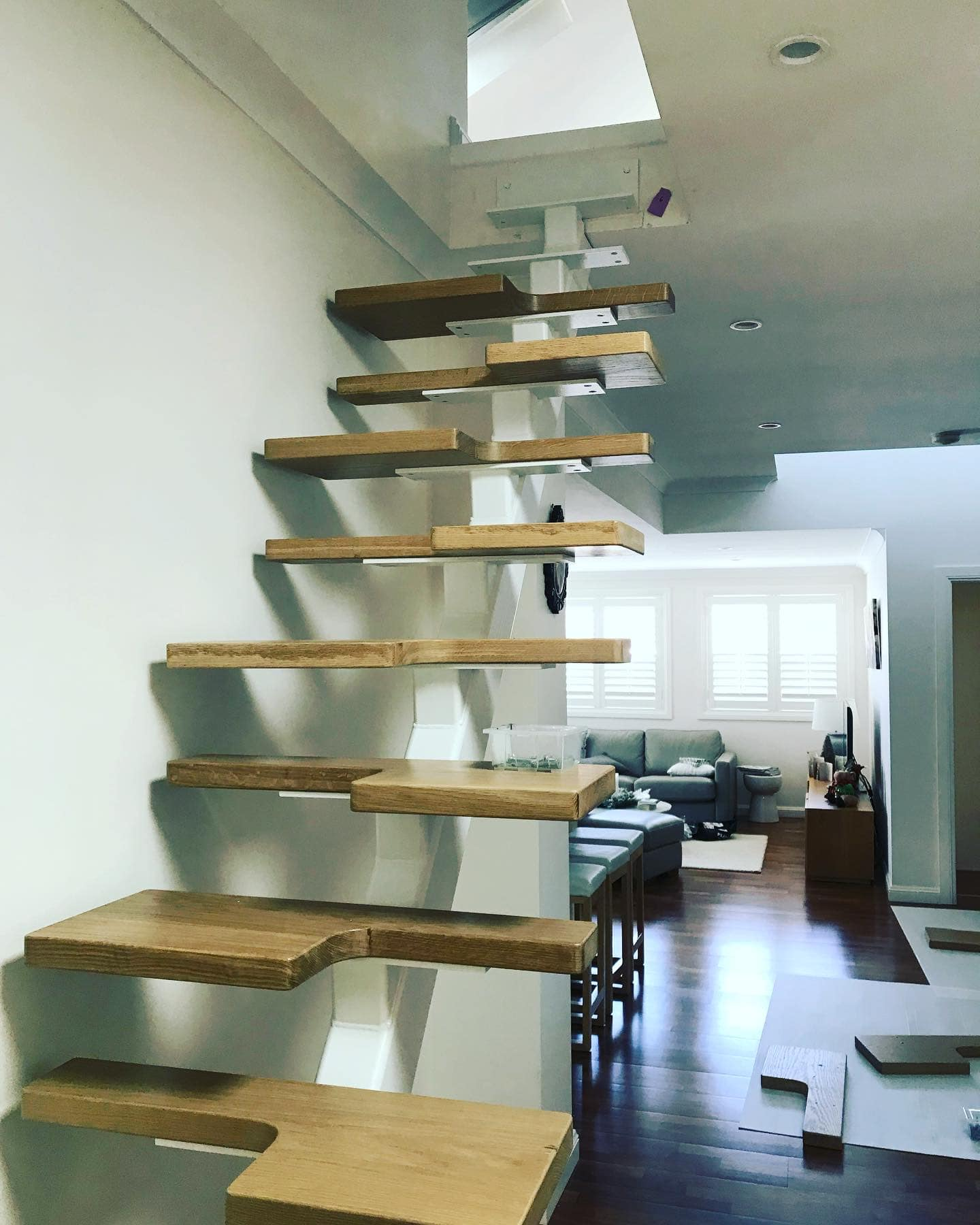 Bexley North floating timber staircase with white steel spine