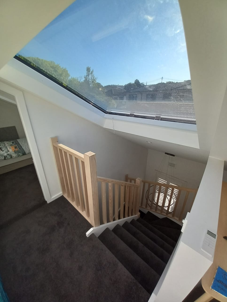 Atlite custom skylight flooding stairwell with natural light