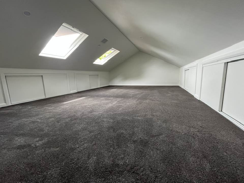 Concord attic after - spacious room with skylights and built-in storage