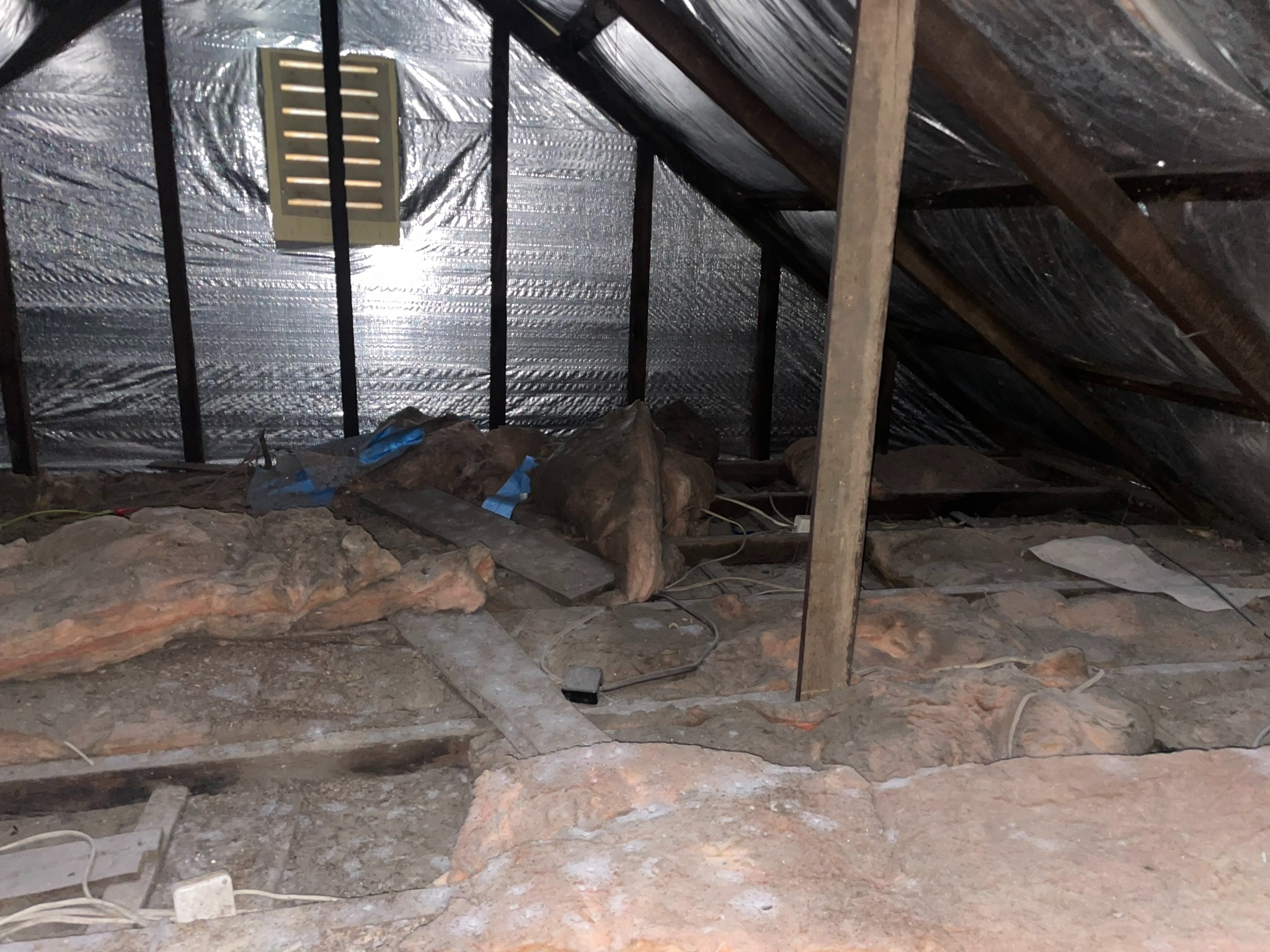 Concord attic before - foil insulation and old batts