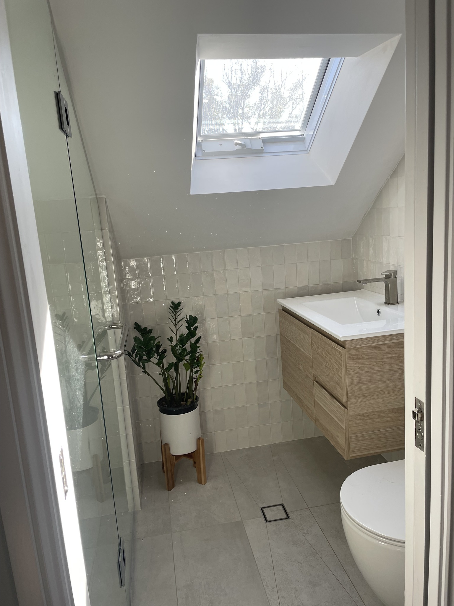 Drummoyne modern ensuite with skylight, glass shower and timber vanity