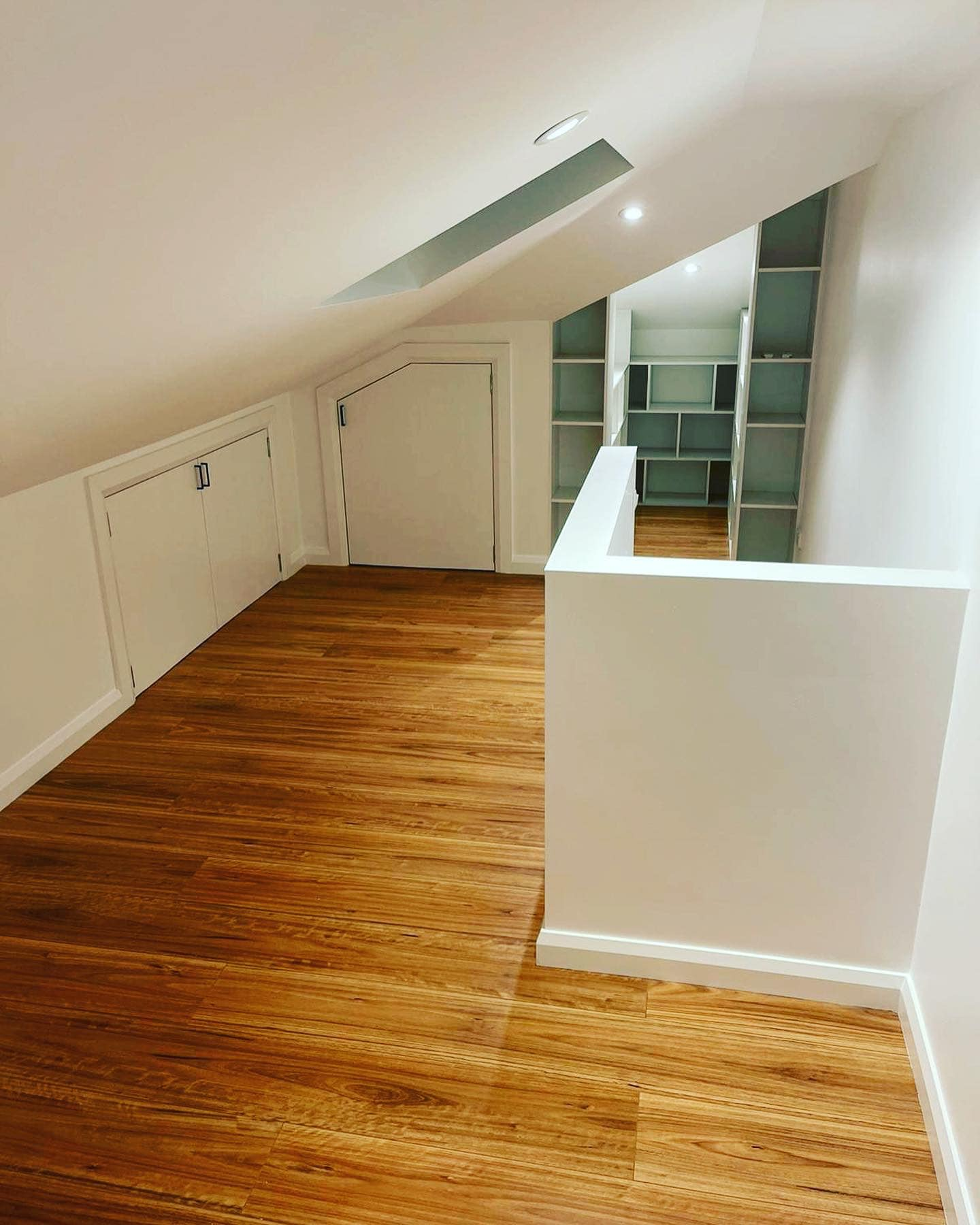 Marrickville office with timber floors, storage cupboards and bookshelves