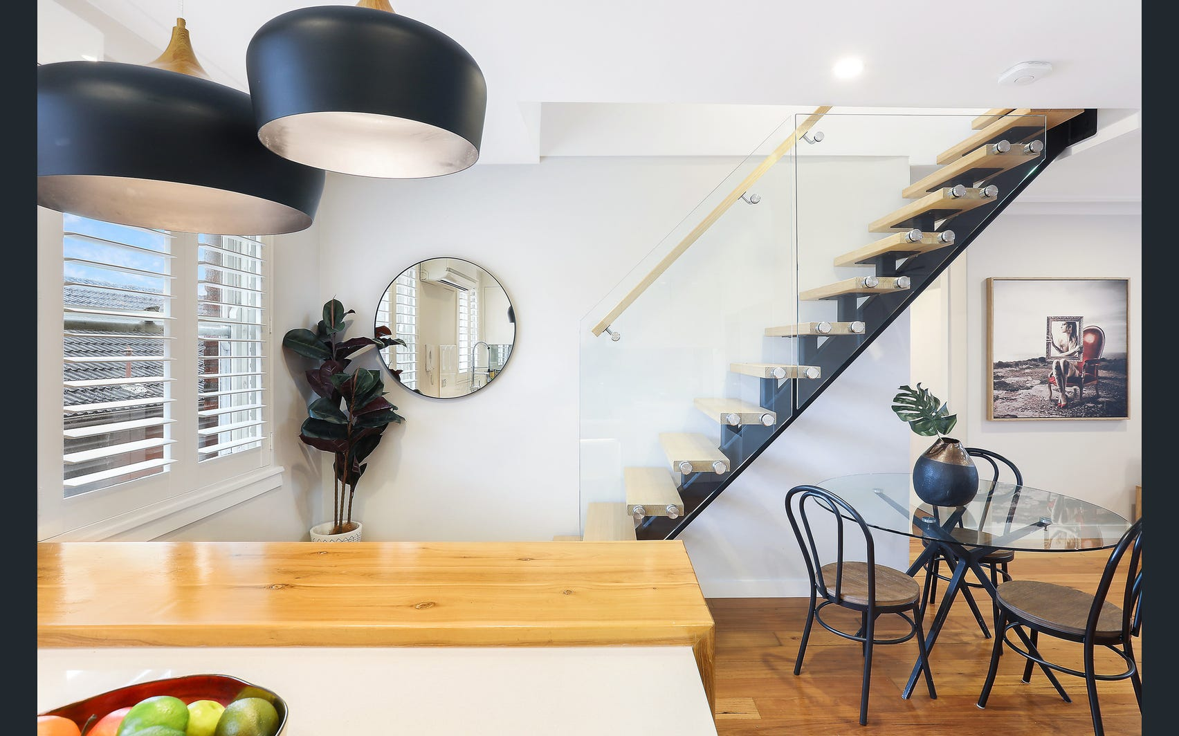 Randwick modern staircase with glass balustrade from kitchen