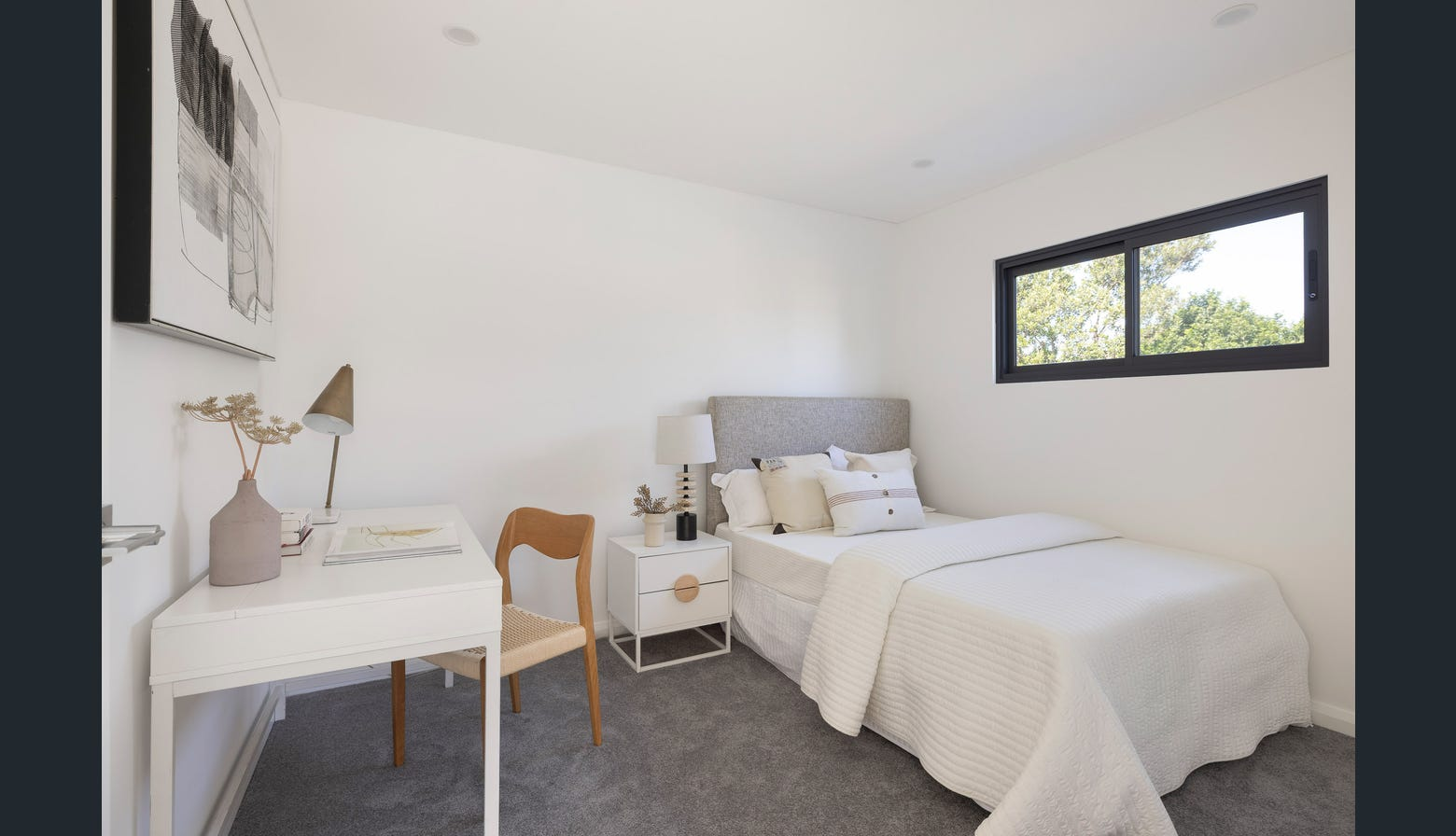 Ryde second bedroom with study desk and artwork