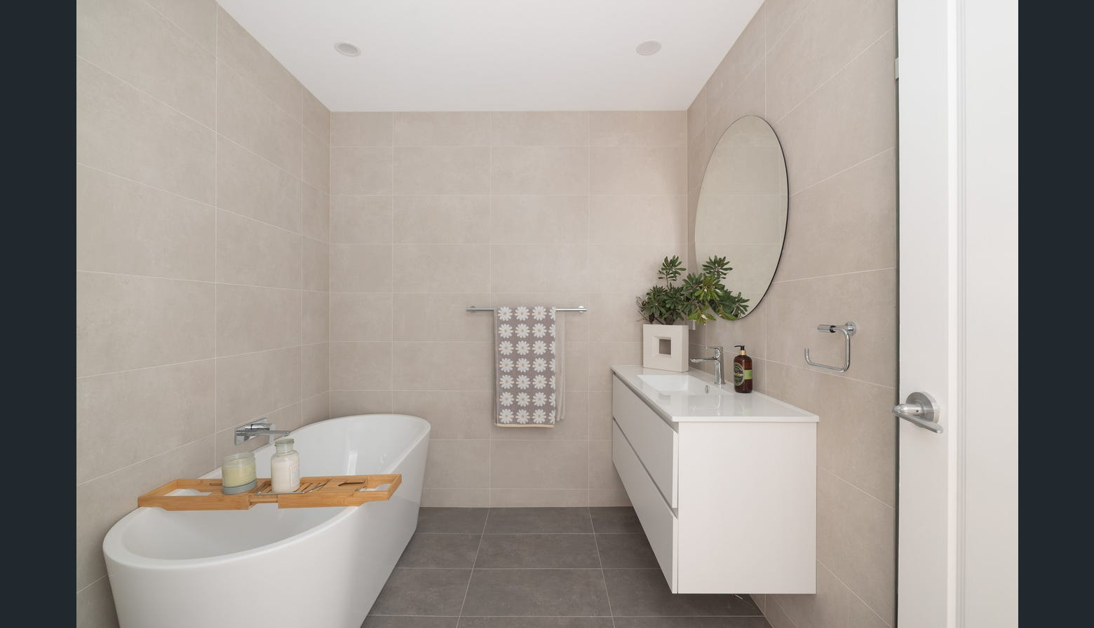 Ryde renovated bathroom with freestanding bathtub and oval mirror
