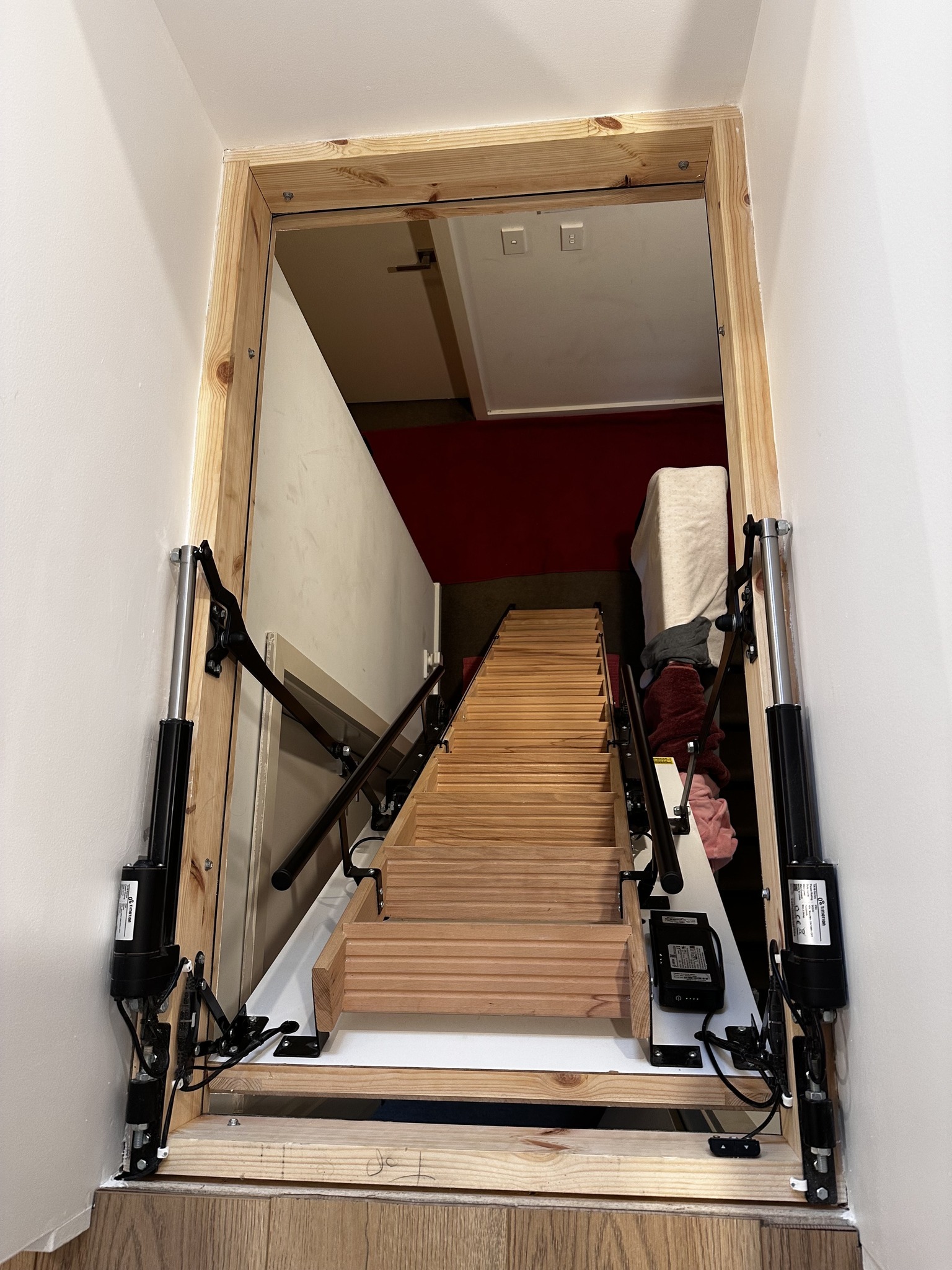Skylark Electric Attic Stairs viewed from below showing timber treads and electric mechanism